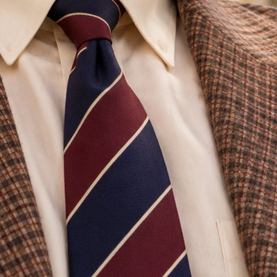 A striped tie and a tweed jacket
